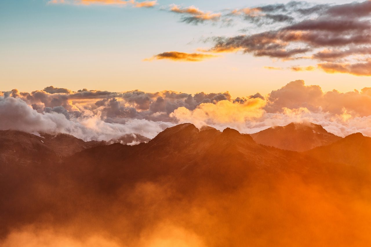 Mountain ridges above a sea of cloud at sunset