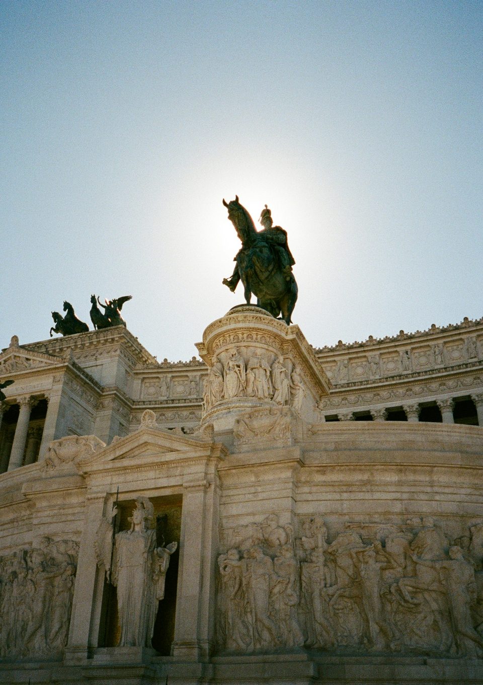 A sculpted monument against a bright sky